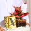 هدية-الأجلونيما-الحمراء-في-صينية-اكريلك-بتغليف-شفاف-مع-معمول-انوش-كرت-اهداء-1-converted-from-png.webp